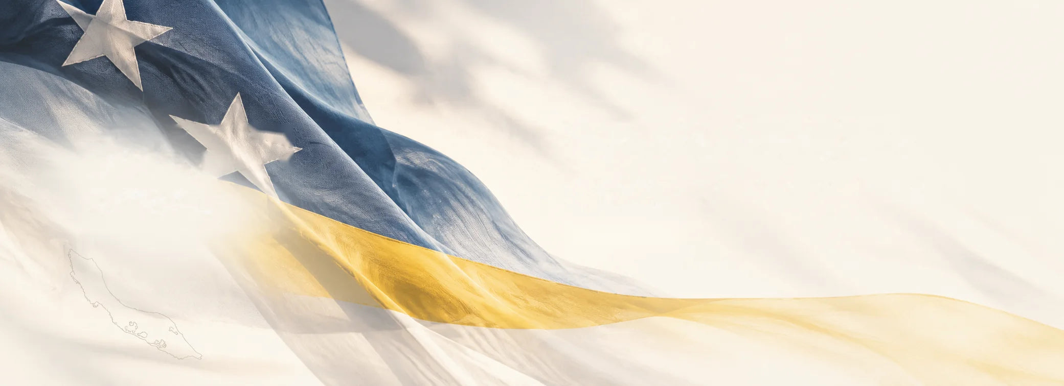 The Curaçao flag waving in soft sunlight