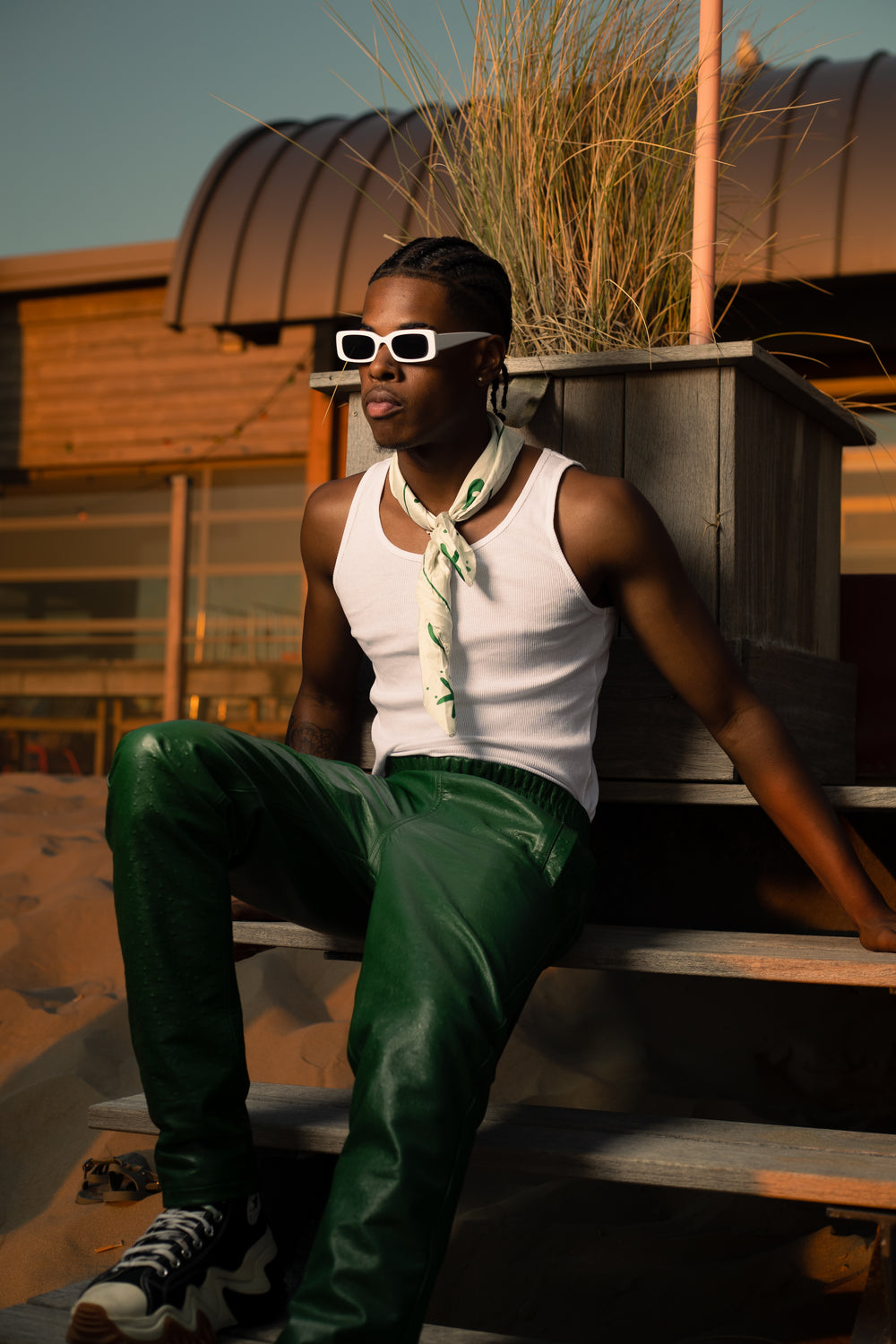 Model in green leather 'Cactus' pants and white tank top