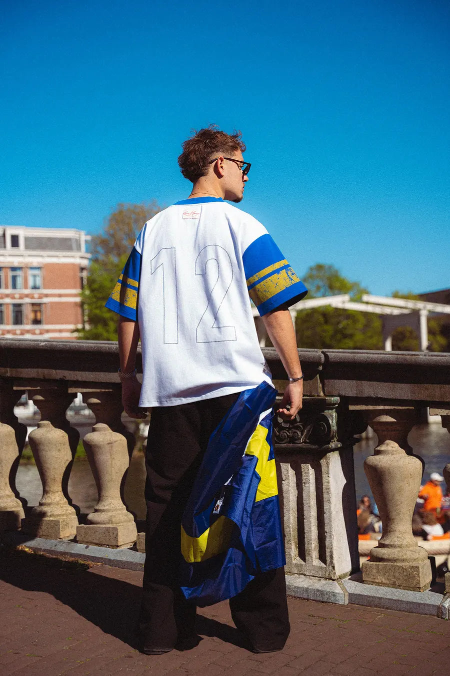 'Nosta12' T-shirt on a canal bridge